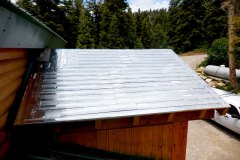 Invizimelt installed beneath a standing seam roof