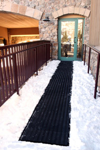 Radiant Trak portable snow melting mats heat walkways and melt snow, ensuring accessibility