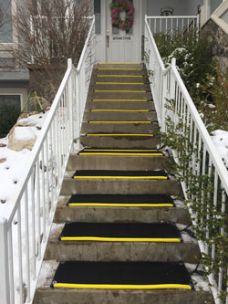 Portable heated stair tread mats melt snow and ice